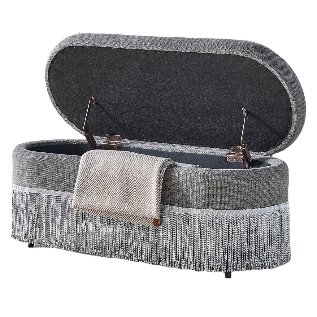 Oval Upholstered Storage Ottoman with Fringe Trim & Lift-Top Lid