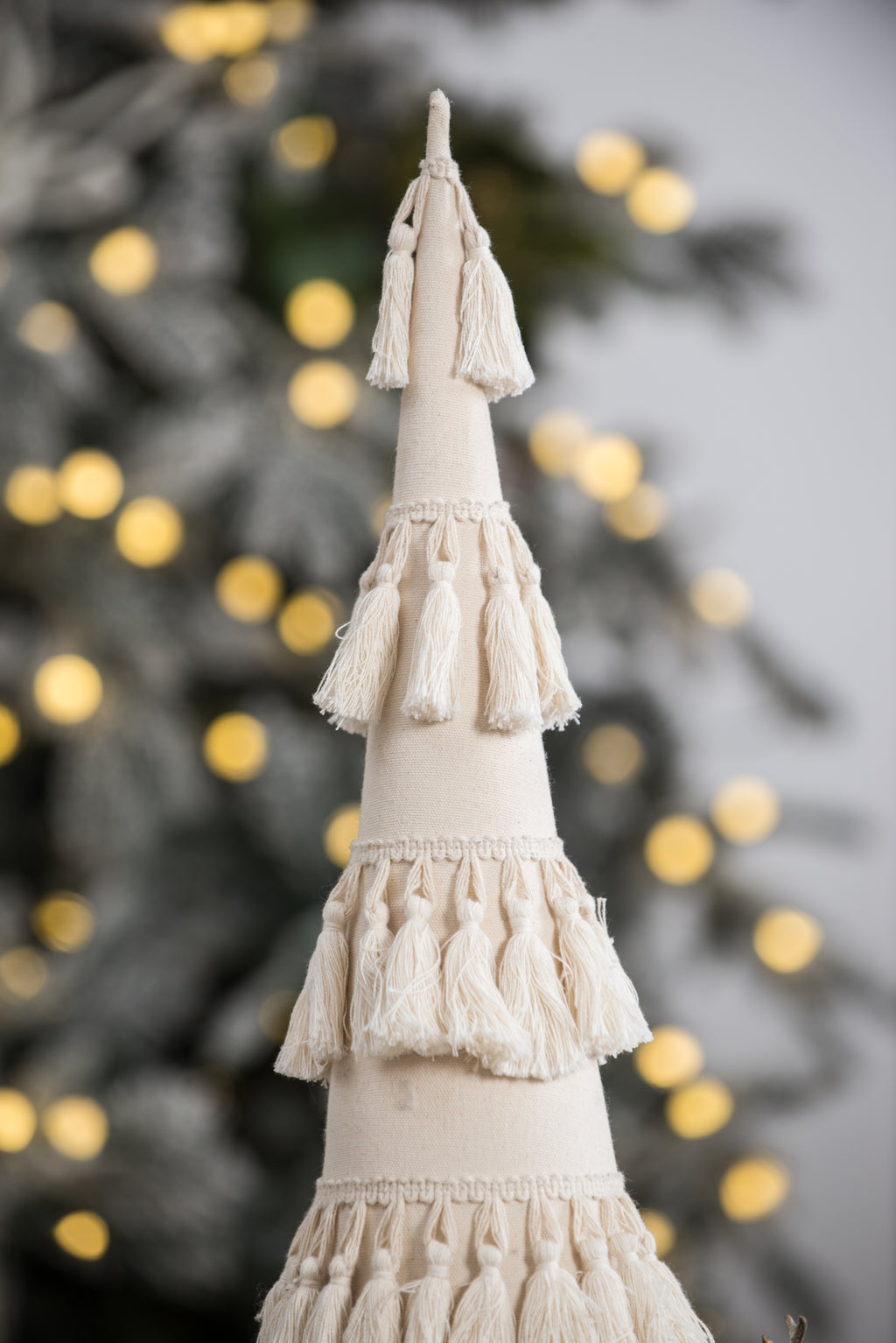 Fringes Embellished Cone With Wooden Base