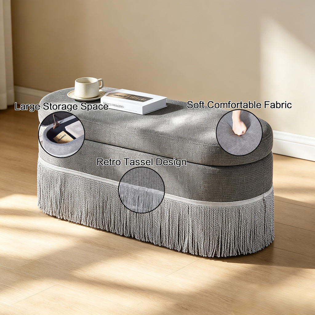 Oval Upholstered Storage Ottoman with Fringe Trim & Lift-Top Lid
