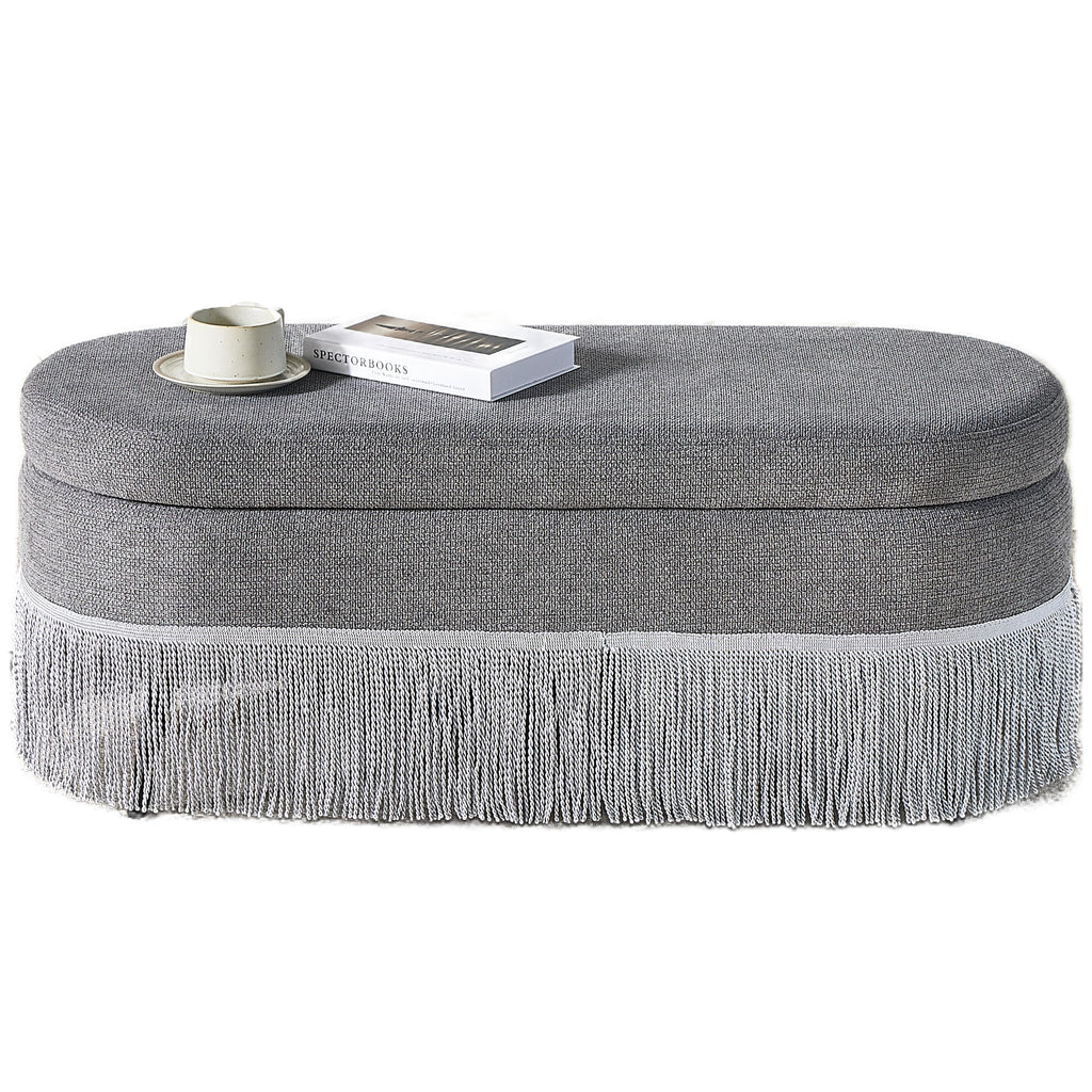 Oval Upholstered Storage Ottoman with Fringe Trim & Lift-Top Lid
