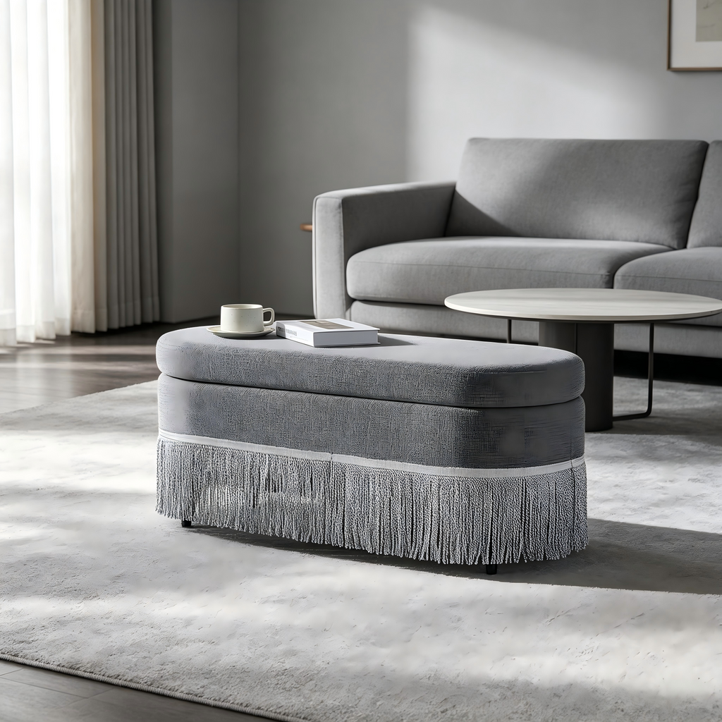 Oval Upholstered Storage Ottoman with Fringe Trim & Lift-Top Lid