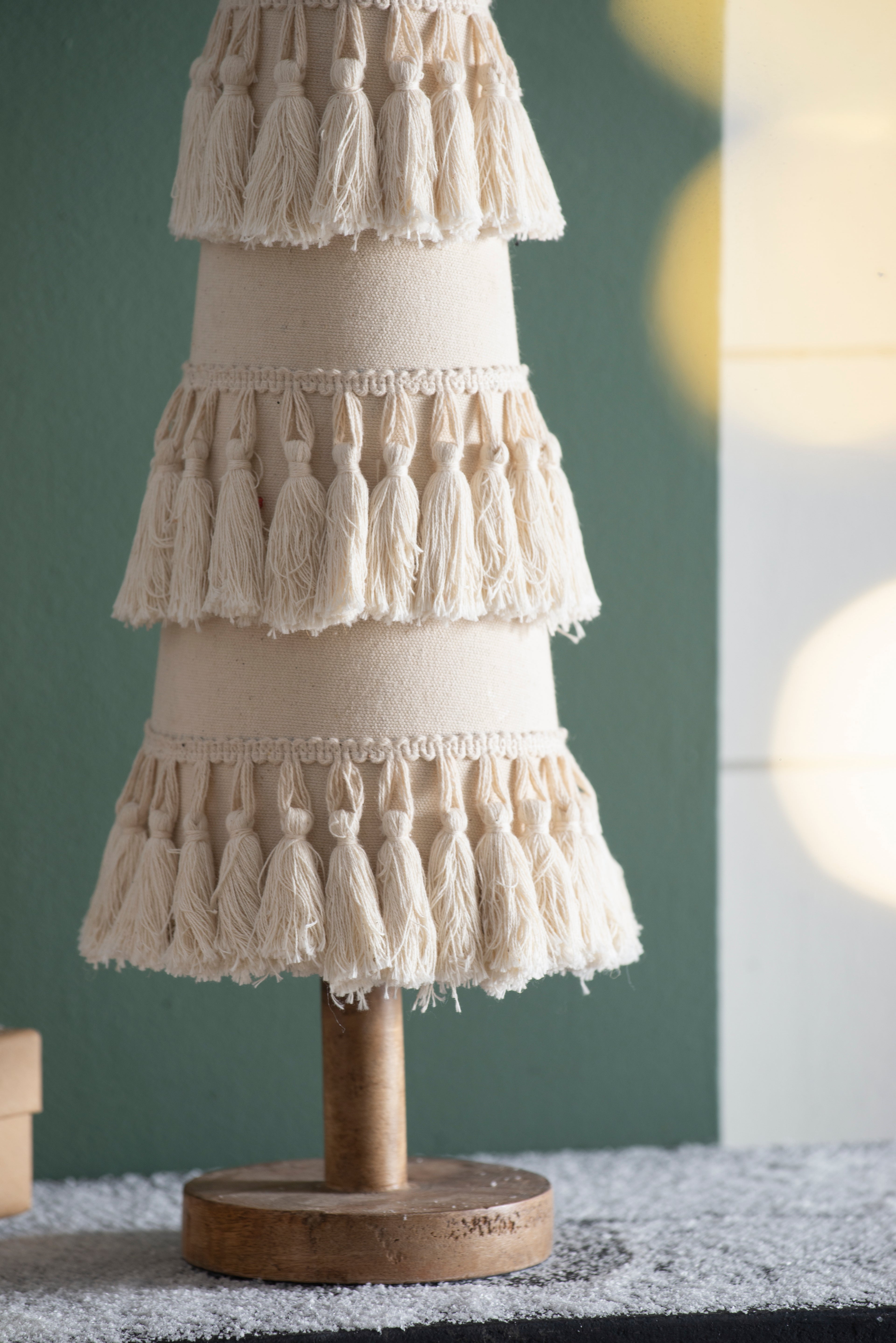 Fringes Embellished Cone With Wooden Base