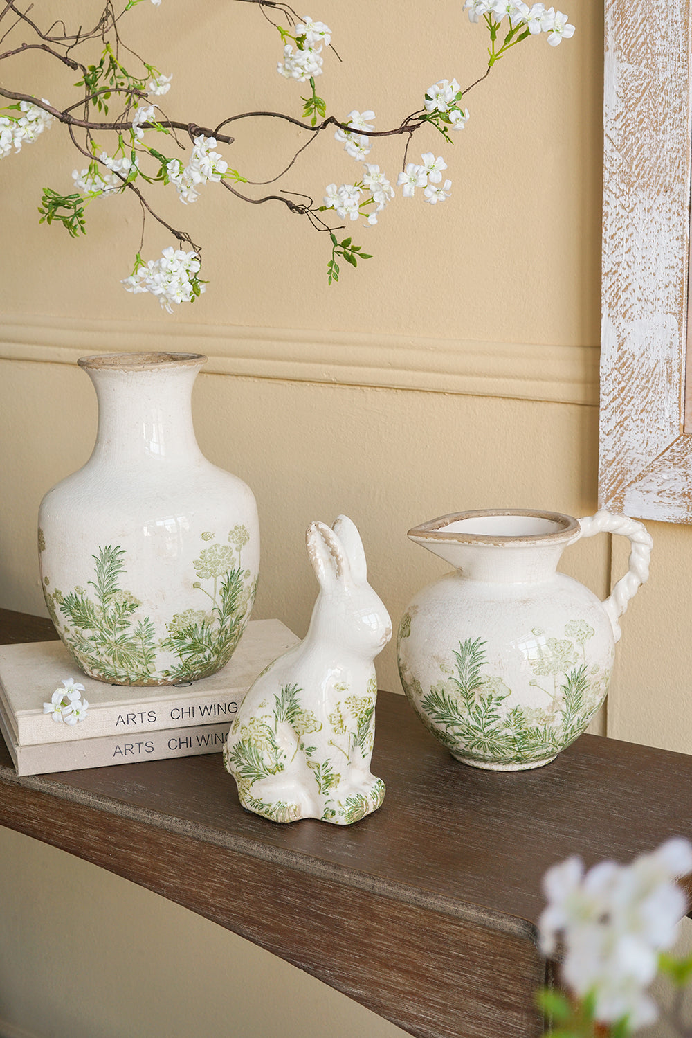 White Ceramic Pitcher Vase with Green Botanical Motifs and Twisted Handle