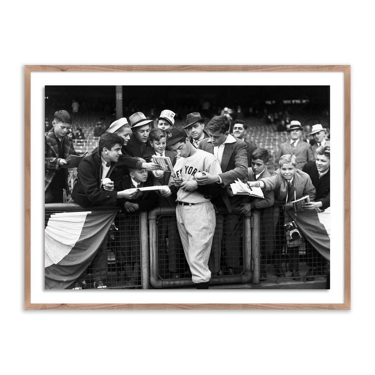 Joe Dimaggio Signing Autotgraphs By Getty Images